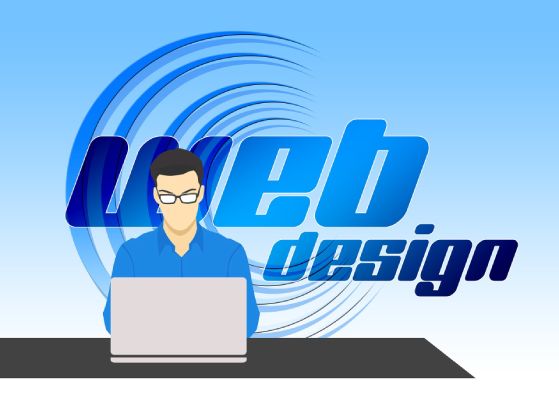 agencia diseño web imagen de un chico con un ordenador en su mesa y la palabra web desing de fondo